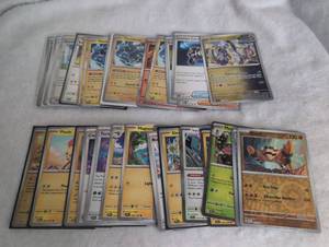 lot 623 image: Pokemon Trading Card Collection with Holographic Cards and Storage Sleeves -31 ct