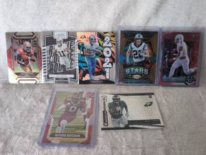 lot 1015 image: NFL Rookie Card Collection Football Trading Cards - Trey Sermon, Tre Tucker, Cam Akers, Christian McCaffrey, Braeden Allen, Rashod Bateman, and Miles Sanders - 7 ct