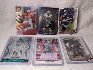 lot 1016 image: NFL Football Trading Cards Collection Mixed Players - Joe Mixon, Ricky Watters, Tyler Allgeier, Travis Hunter, Jahmyr Gibbs, and Kenneth Walker III - 6 ct