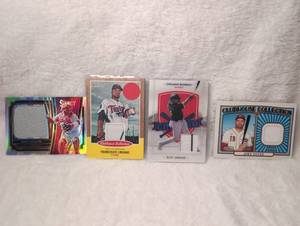 lot 3029 image: Baseball Card Collection with Game-Used Memorabilia -&nbsp&nbspDeivy Grullon, Francisco Liriano, Eloy Jimenez, and Joey Votto with embedded game-used jersey material pieces