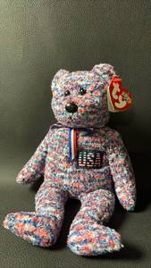 lot 34 image: 2000 Retired TY Beanie Baby USA Bear with Tags featuring a red, white, and blue patterned plush design.
