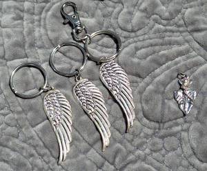 lot 102 image: Mixed Jewelry Lot with Angel Wings Keychains and Gemstone Necklaces