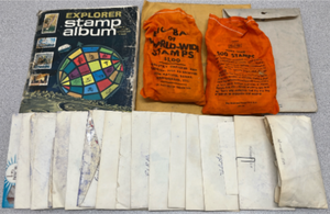 lot 217 image: Stamp Collection - Explorer Stamp Album with hundreds of loose Domestic and International Stamps