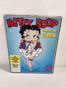 lot 113 image: Betty Boop Pendulum Clock with Moving Legs