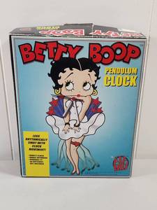 lot 137 image: Betty Boop Pendulum Clock with Swinging Legs