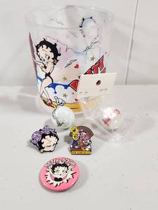 lot 142 image: Betty Boop Collectible Glass Set with Pins Marbles and Button