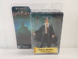 lot 209 image: NECA Harry Potter Series 2 Action Figure with Wand and Base