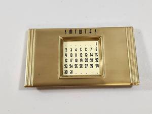 lot 281 image: Gold Tone Perpetual Desk Calendar with 50 Year Reference Chart