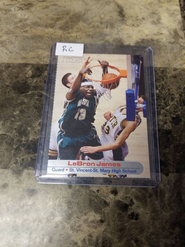 lot 1272 image: 2004 Sports Illustrated for Kids LeBron James St. Vincent-St. Mary High School Rookie Basketball Card