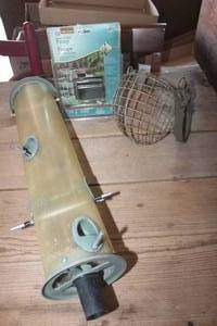 lot 4809 image: Vtg. Dog Muzzle, NIP Pump & Bird Feeder