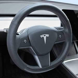 lot 304 image: Uxcer Carbon Fiber Leather Steering Wheel Cover for Tesla Model 3Y 2016-2025 2026 JuniperHighland, Non-Slip Breathable Steering Wheel Protector for Tesla Model 3Y Accessories 2026 - Retail $28