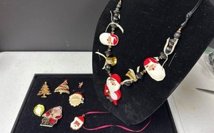 lot 204 image: Christmas Holiday Jewelry Set with Santa Claus Necklace and Brooches
