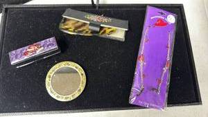 lot 224 image: Vanity Set with Mirror, Comb, Lipstick Case, and Eye Glass Holder