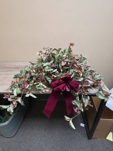 lot 399 image: Christmas Holiday Centerpiece with Red Berries and Burgundy Bow - would look great on a shelf to allow the foliage to hang over