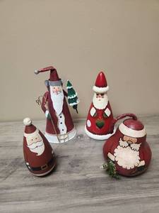 lot 406 image: Christmas Santa Claus Holiday Decoration Set - three wooden one metal