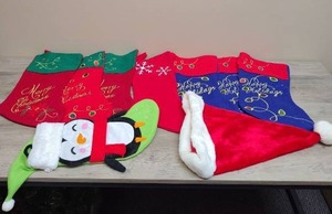 lot 440 image: Christmas Stocking Collection with Santa Hat and Penguin Decoration