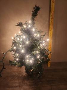 lot 485 image: Small Tabletop Christmas Tree with String Lights and Gold Pot