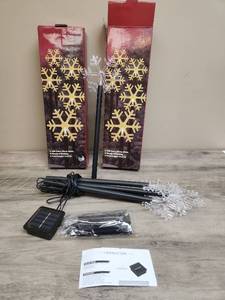 lot 488 image: Solar Powered LED Snowflake Stake Lights Set. 2 sets. 5 snowflakes per box.
