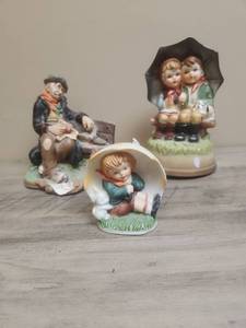 lot 544 image: Ceramic Figurine Collection with Elderly Man (has a chip on the bottom front) and Children with umbrellas