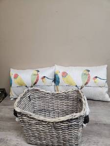 lot 568 image: Woven Storage Basket with Handles and two Bird Motif Throw Pillows