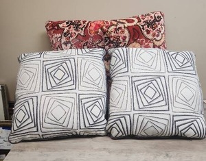 lot 570 image: Decorative Throw Pillows, two gray geometric and one large pink paisley pattern