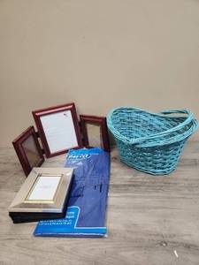 lot 577 image: Blue wicker basket with handle, picture frames and a blue plastic tablecloth