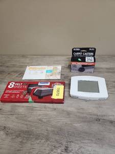 lot 611 image: Home Improvement Bundle - Honeywell Thermostat, Filtrete Air Freshener, Furniture Pads, Carpet Casters