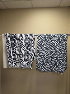 lot 620 image: Two Zebra Print Throw Blankets, one lightweight and one is sherpa lined