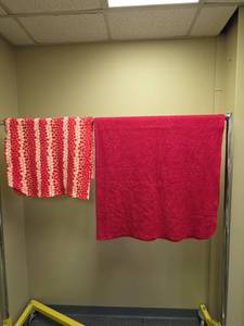 lot 622 image: Red Toned Throw Blankets - one has faint grape vine pattern and the other has hearts