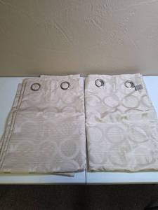 lot 628 image: Two grommet style polyester blackout curtains in shimmering beige with circle patterns