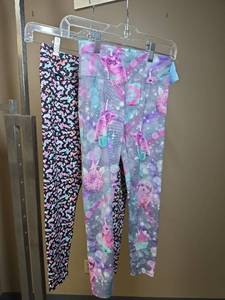 lot 1167 image: Two pairs of young girls size 10 leggings