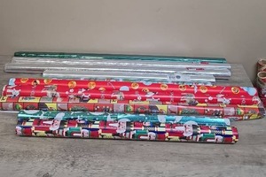lot 397 image: Christmas wrapping paper and gift basket foul wrap - most are new unopened