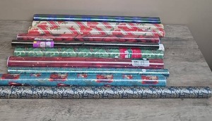 lot 398 image: Large lot of gift wrap - mostly Christmas,  some baby and birthday - most are still in wrapper