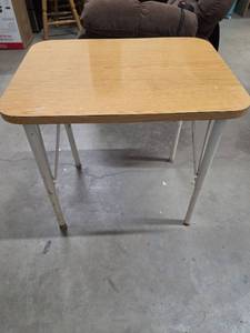 lot 25 image: Small Adjustable Height Wood laminate table with metal legs. Has some marks on top and on legs, sturdy.  Appears to be adjustable but would require using tools. 24W x 18D x 23H