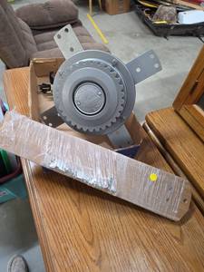 lot 30 image: Hunter Ceiling Fan. Blades are 22 in long, reversible gray on one side, brown on the other.  No light kit, but model specs says it is light kit compatible.