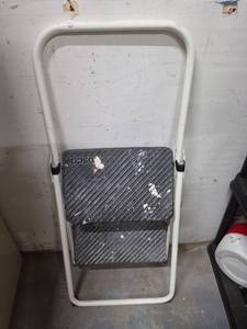 lot 33 image: Cosco 2-Step Folding Step Ladder with Handrail (folds up immediately when you pick it up). Has some paintdrywall mud on it.