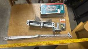 lot 1709 image: Commercial Door Hardware Lock Reinforcement Kit with Stainless Steel Plates, Door Closer, and other hardware items