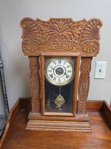 lot 6 image: Vintage Ornate Wooden Mantel Clock with Pendulum. 14.75W x 4.75D x 23H.  Not functioning.