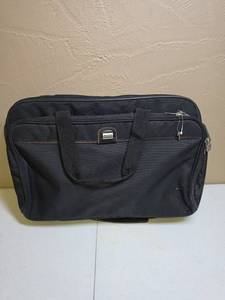 lot 636 image: American Tourister Black Skinny Luggage Bag with Shoulder Strap