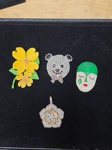 lot 203 image: Costume Jewelry Pins and a Pendant