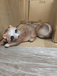 lot 53903 image: Decorative Raccoon Garden Statue