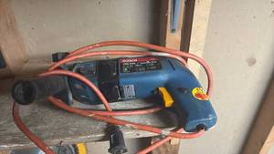 lot 51816 image: Bosch 1198 VSR 38 Inch Hammer Drill - Retail $45