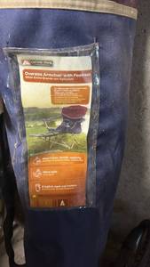 lot 51855 image: Ozark Trail Oversize Armchair with Footrest Camping Chair - Retail $35