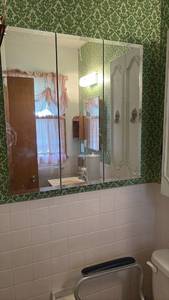 lot 51984 image: White Bathroom Medicine Cabinet with Mirrored Doors  Must Remove  - Retail $45