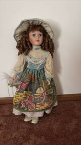 lot 52014 image: Porcelain Girl Doll with Curly Brown Hair and Floral Dress - Retail $25
