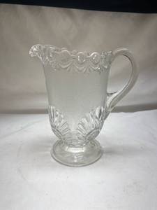 lot 656 image: Pressed Glass Pitcher with Scalloped Edge and Handle - Manganese Glow under UV365nm