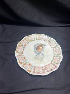 lot 666 image: 1909 Calendar Plate with Woman Portrait and Floral Border