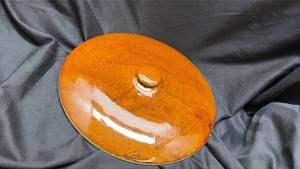 lot 646 image: Handmade Ceramic Crockpot Lid with Amber Glaze