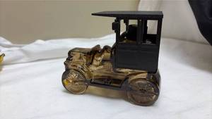 lot 709 image: Avon Tai Winds After Shave Glass Car Bottle - Empty.