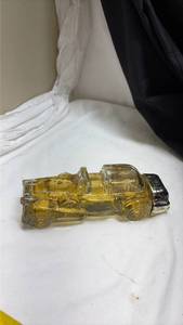 lot 711 image: Avon After Shave Yellow Glass Classic Car Bottle - full. (No Sticker)